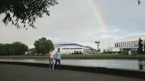 A couple promenading at the riverside Stock Footage 66187511