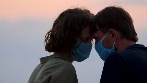 Couple in protective masks. Side view close up faces of man and woman in medical Stock Footage 142224403