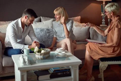 Couple with psychologist solving problem in relationship 写真素材