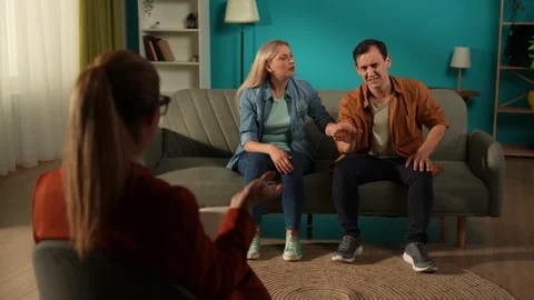 A couple at a psychotherapy session solving their problems. Back view of a Stock Footage 252400210