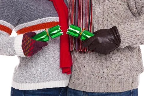 Couple pulling a christmas cracker Stock Photos