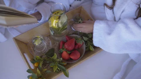 Couple reading book at breakfast with fruit Video stock 265654749