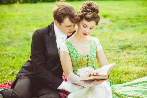 Couple reading a book Stock Photos