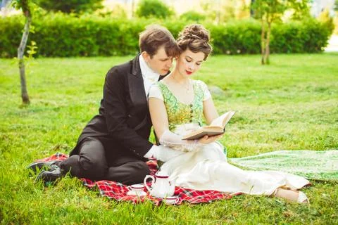 Couple reading a book Stock Photos