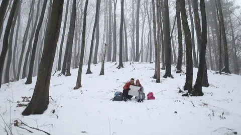 Couple Reading The Map in Forest Видео 103772366