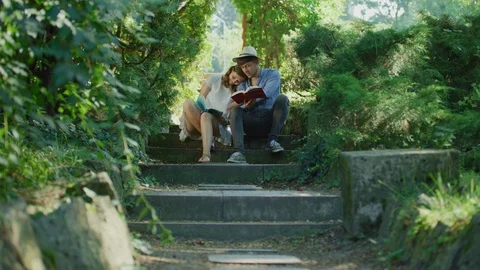 Couple reading together Stock Footage 99964714