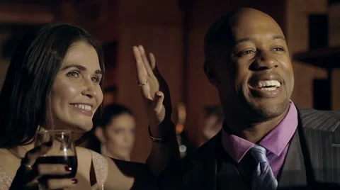Couple recognizes people they know at a party Stock Footage 42892290
