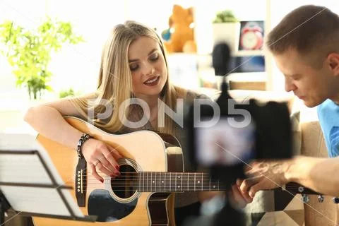 Couple Recording Music Video Blog Home Lesson Stock Photos