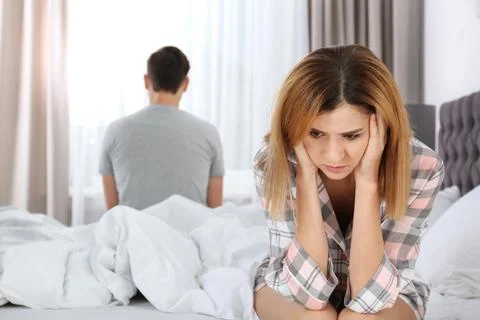 Couple with relationship problems ignoring each other in bedroom Stock Photos
