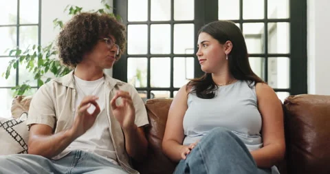 Couple, relax and talking on couch at house for first date, explain interests Stock Footage 321824004