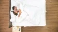 The couple relax in the bed. view from above. time lapse 4k or 4k+ Resolution