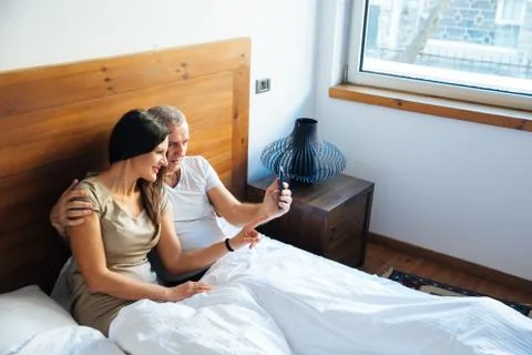 Couple Relaxing in the Bed Stock Photos