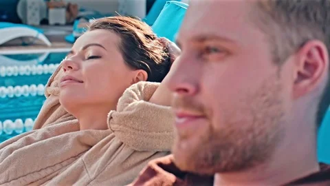 Couple Relaxing On Deckchairs Stock Footage 78595947