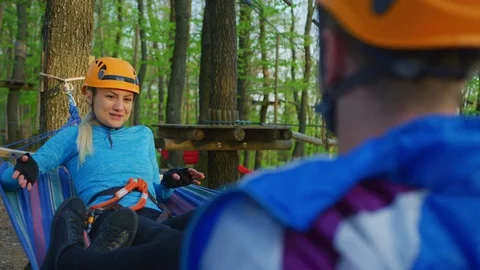 Couple relaxing in a hammock Stock Footage 99962120