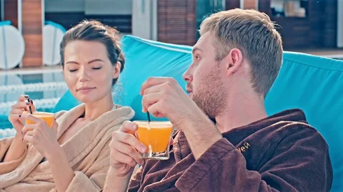 Couple Relaxing At The Pool Stock Footage 78595978