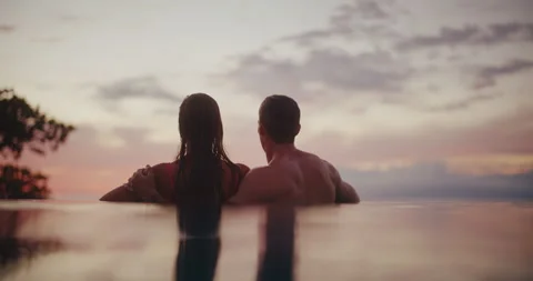Couple Relaxing in the Pool on Vacation Stock Footage 225851368