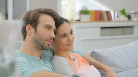 Couple relaxing in sofa and watching tv Stock Footage 57239432