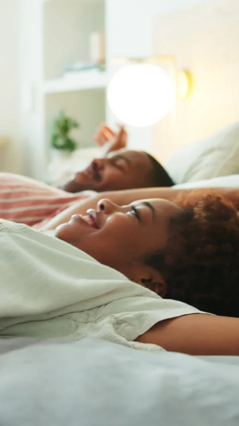 Couple, rest and happy on bed, home and fall together on break or chilling with Stock Footage 340780285