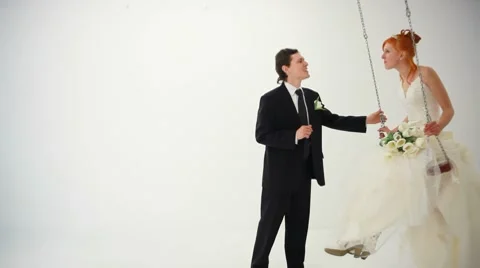 Couple on a rest on a swing Stock Footage 8561097