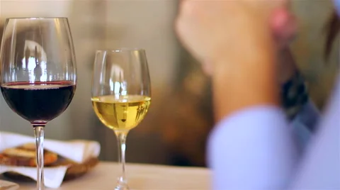 A couple on a restaurant drink wine and eat entries. Stock Footage 63134953