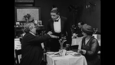 Couple in restaurant sharing their bread due to food crisis, UK 1917 Stock Footage 131079712