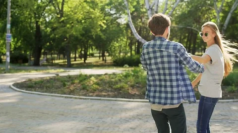 Couple rides Hoverboard in park. Medium shot Vídeos de archivo 74691458