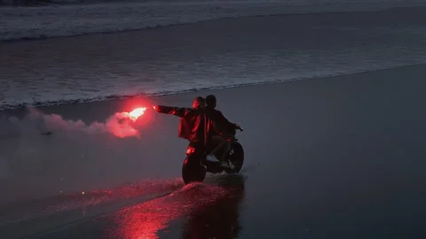 Couple rides motorcycle, holding red warning light. Man, woman drive bike Vídeo Stock 319036719