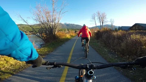 Couple Riding Bikes On A Path During Autumn Video stock 119277508