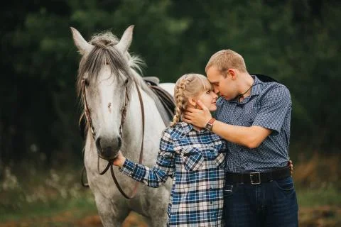Couple riding in forest Stock Photos