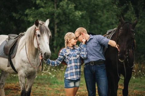 Couple riding in forest Stock Photos