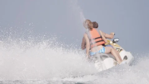 Couple riding jet ski. Stock Footage 119396306