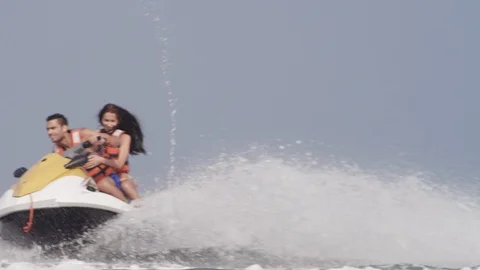 Couple riding on jet ski. Stock Footage 119396405