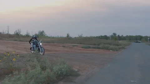 Couple riding a motorcycle Stock Footage 87167631