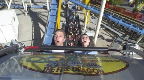 A couple riding a roller coaster. Stock Footage 52263836