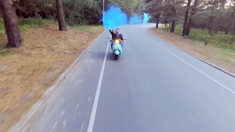 Couple riding a scooter. Stock Footage 97320391