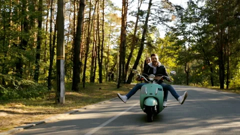 Couple riding a scooter. Stock Footage 97320741