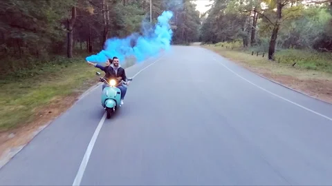 Couple riding a scooter. Stock Footage 97768506