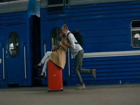 Couple Riding On Suitcases 스톡 동영상 78773113