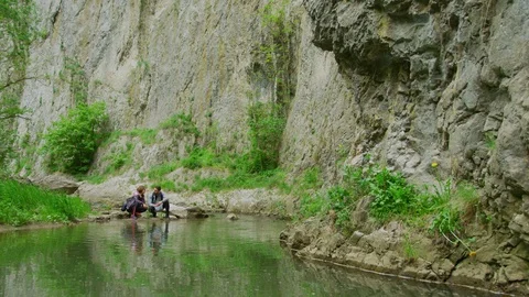 Couple on the river bank Stock Footage 99963176
