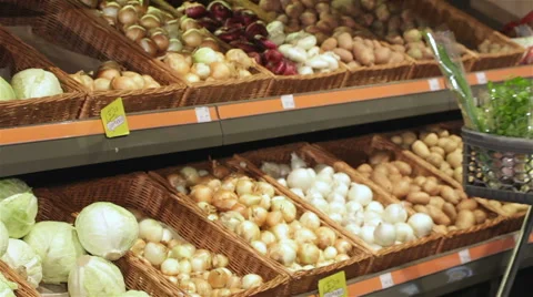 Couple roll trolley with products at the hypermarket Stock Footage