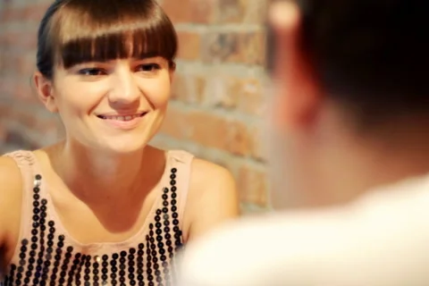 Couple on romantic date in restaurant, focus on woman Stock Footage 1214816