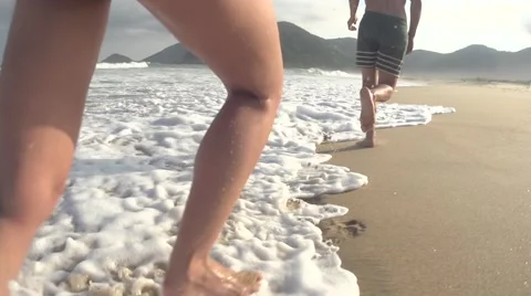 Couple runing in beach in slowmotion Stock Footage 68098535