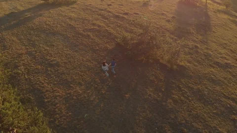 Couple runing at sunset Stock Footage 93977704