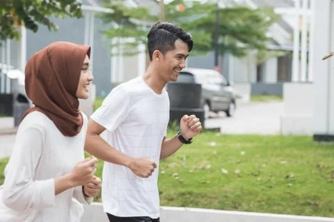 Couple runner working on exercise and warm up Stock Photos