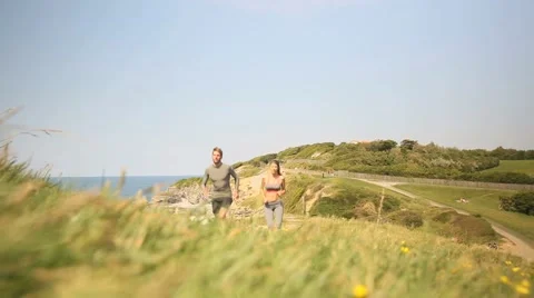 Couple of runners exercising by cliff Stock Footage 51309854