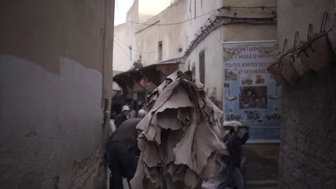 Couple runners in the middle Small Back Street Between Buildings at Morocco Stock Footage 106424139