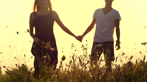 Couple running away on the meadow Stock Footage 50067992