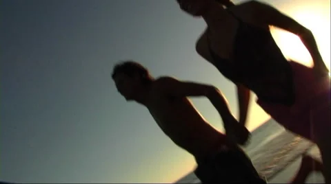 Couple running on beach Stock Footage 43688996