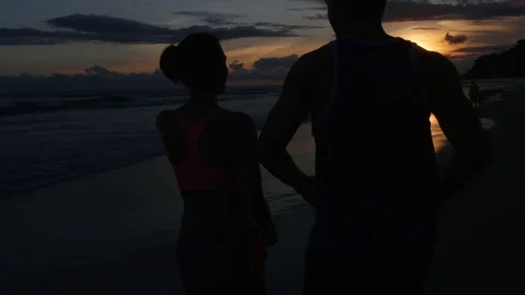 Couple running in the beach Stock Footage 71472888