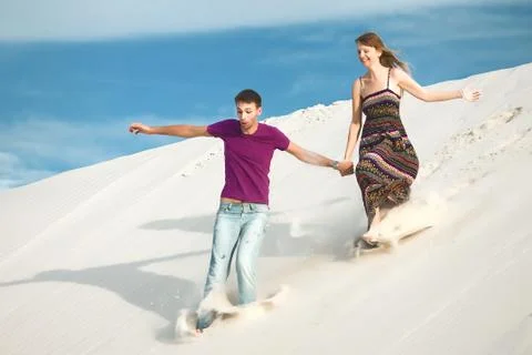 Couple running from mountain Stock Photos